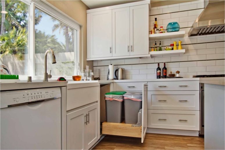 a smart use of a corner cabinet for trash can storage (Jackson Design &amp; Remodeling)