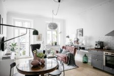 01 This Scandinavian apartment features beautiful historical elements and some pastel and muted touches here and there
