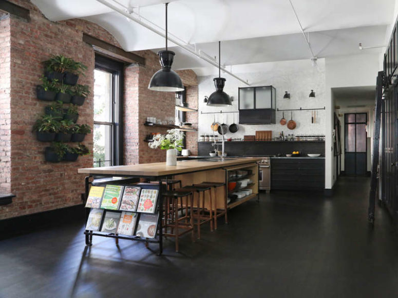 Kitchen In A Loft Style With Concrete And Brick Walls And Tiles A