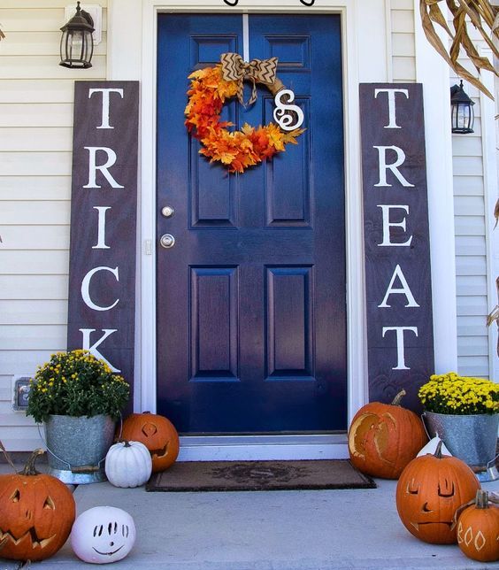 stylish navy and white sidelight signs for a bold Halloween front door and a porch