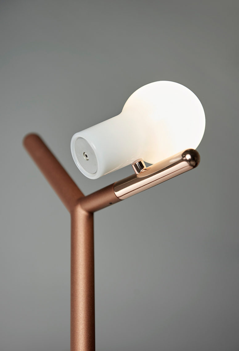 The lamp is inspired by a bird sitting on a branch and there's a bulb that imitates it