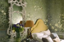 04 The guest room is luxurious with its 18th century mirror and an upholstered bed