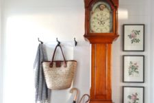 05 a large grandfather’s clock is a show-stopper in a rustic entryway