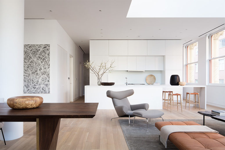 The furniture is a mix of vintage and custom made furniture, the mix looks unique and bold artworks add style to the space