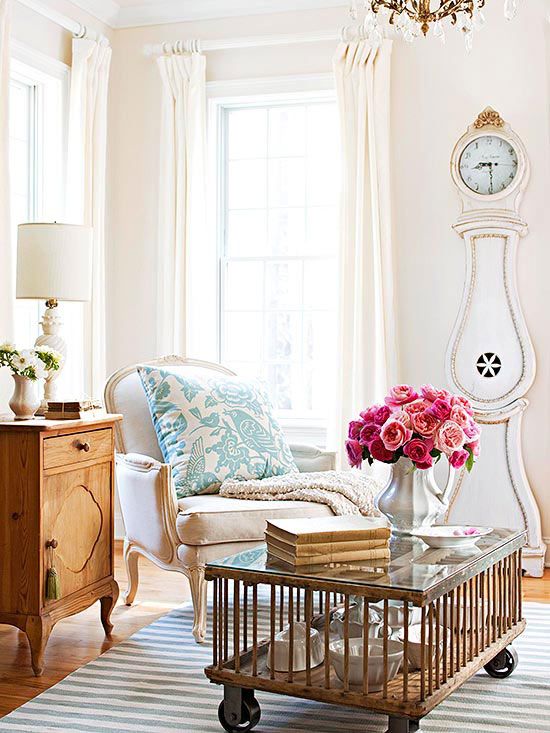a chic living room with a refined flavor and a gorgeous white and gold grandfather's clock
