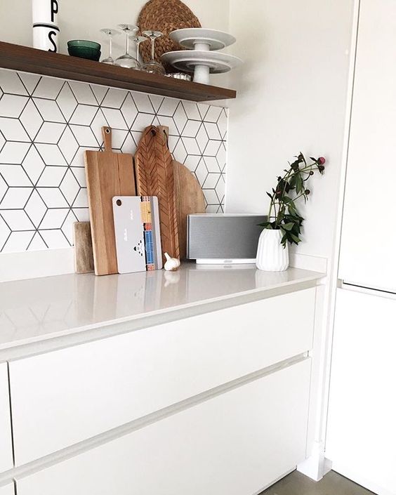 white matte kitchen with geometric cube tiles and black grout to define them