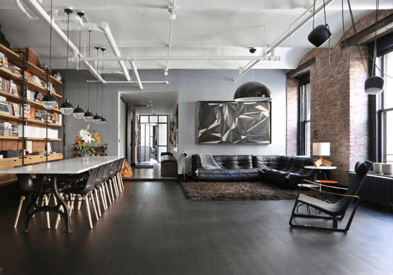 Exposed pipes and brick walls comprise a perfect backdrop for an industrial dwelling