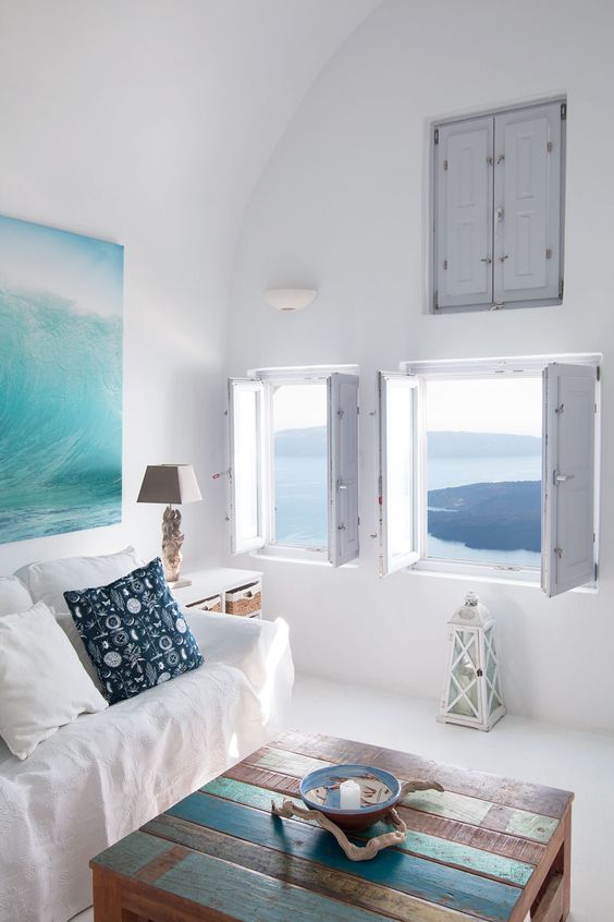 everything is whitewashed here, and the accents are made with an art piece and a pallet coffee table