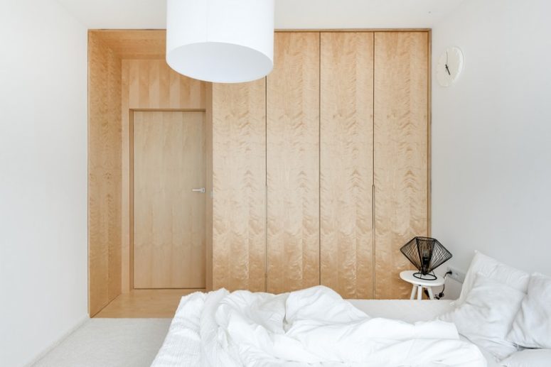 The storage is represented with textural wood panels without any handles