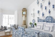 09 a chic blue bedroom with porcelain vases and a chic vintage clock in the corner