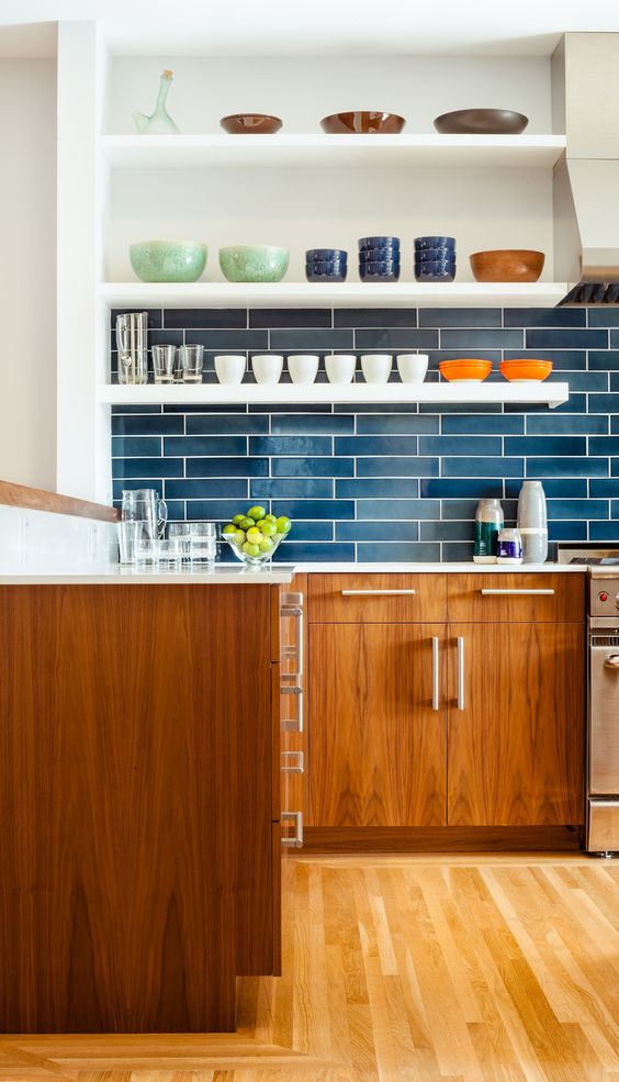 brick-inspired glossy blue tile backsplash with white grout to make it stand out