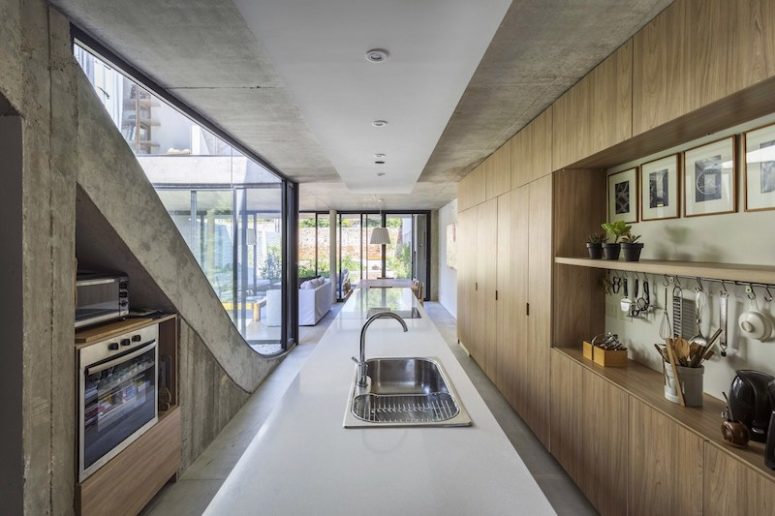 The materials are basic and pure, and everything is centered around the cool garden views and courtyard