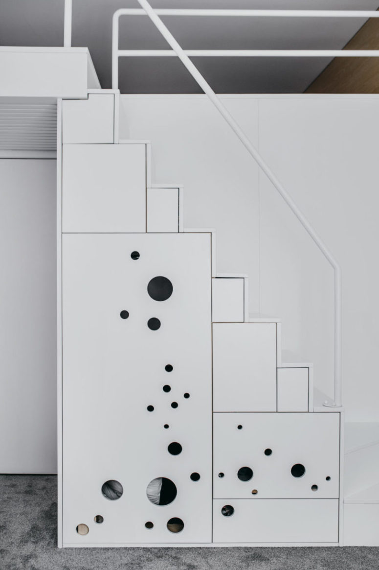These shelving units comprise a staircase that leads to the parent's bedroom