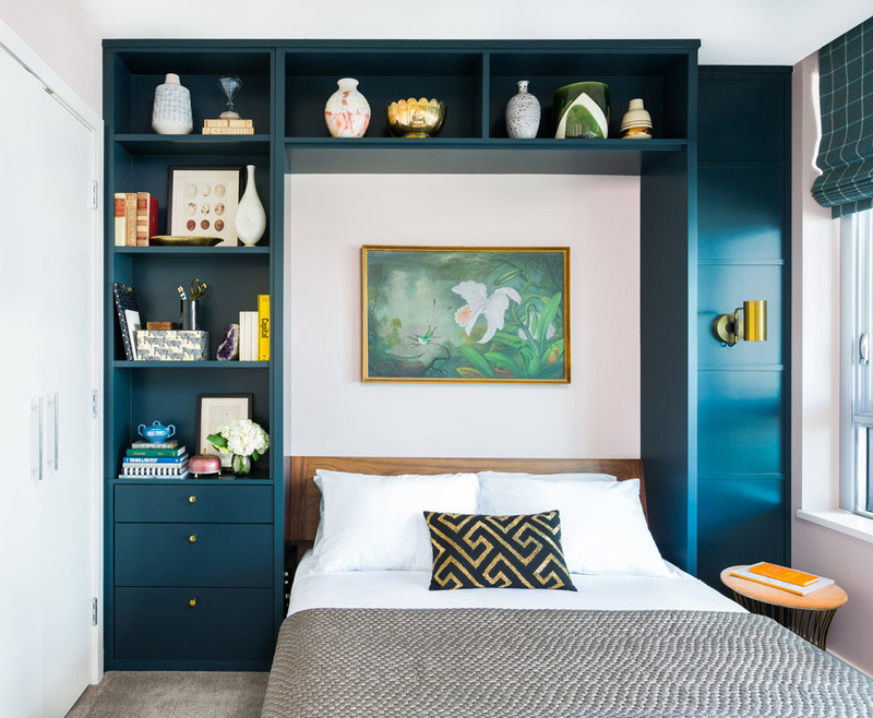 nice colorful shelving unit addition to the bedroom