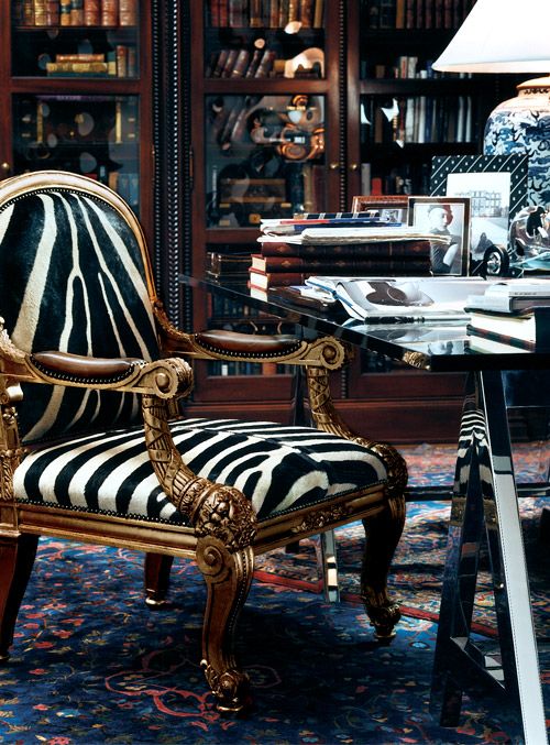 a refined vintage armchair with zebra print upholstery