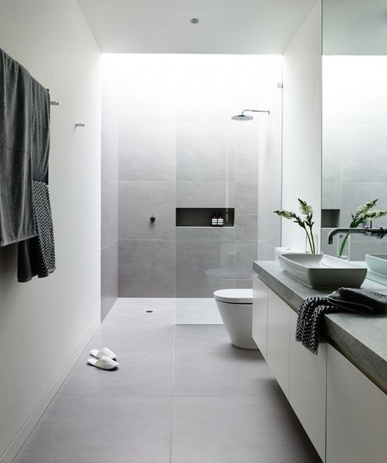 large scale matte grey tiles for a peaceful minimalist bathroom