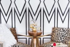 13 statement geo wallpaper wall and brass cheetah print chairs, a faux fur gur make this nook very glam