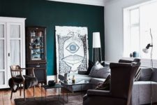 16 a Scandinavian living room in traditional colors for this style is spruced up with a teal wall