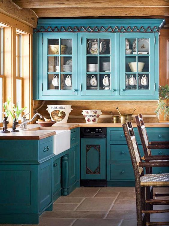 https://www.digsdigs.com/photos/2017/08/17-turquoise-blue-cabinets-in-vintage-style-and-lots-of-natural-wood-for-a-rustic-feel.jpg