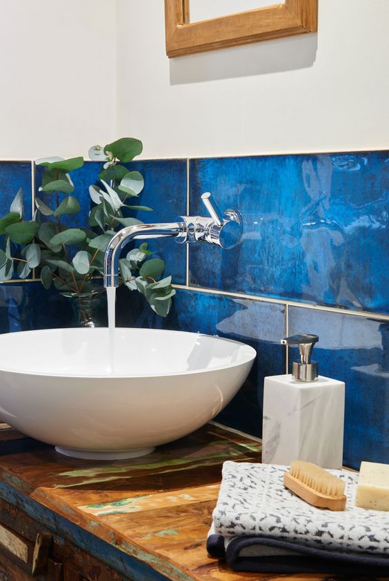 give your bathroom walls the wow factor with intense blue and glossy finish tiles