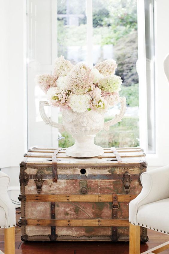 rustic vintage trunk as a side table for a living room, storage space included