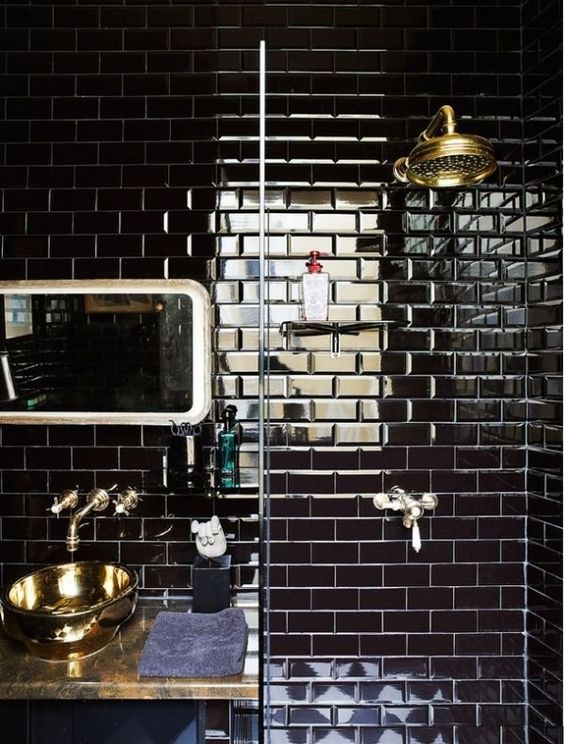 glossy black tiles make this masculine art deco bathroom amazing