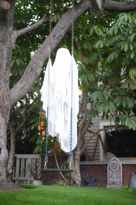 attach a cheeseloth ghost to a swing and it will seem that it's floating in the air