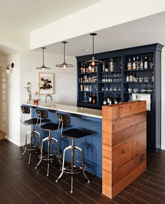 a kitchen countertop hides the cooking space and acts as a meal space