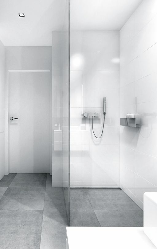 matte grey large scale tiles for a minimalist monochrome bathroom