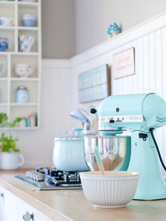 a pastel kitchen look can be polished with a mint mixer