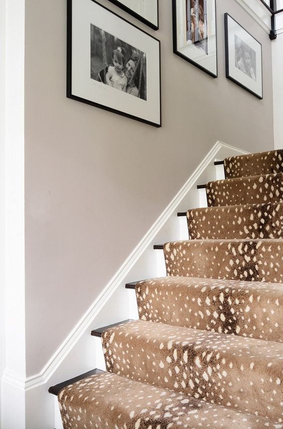 deer spot print rug covers the stairs and makes the space cozier