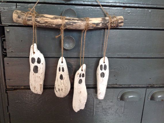 make cute ghosts with driftwood, small rocks and acrylic paints 