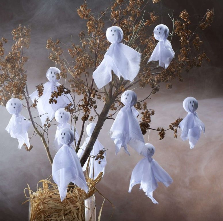 a simple yet easy to make ghost tree is a cool DIY project for Halloween