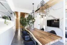 01 This gorgeous modern apartment is a living space and a design studio in one, it’s defined by modern touches and lots of greenery and trees