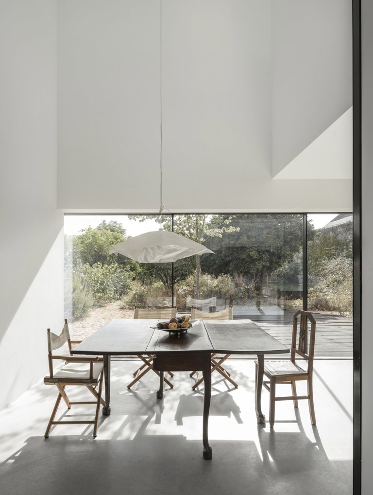 Inside the house is modern, done with white and some rustic furniture white color reflects light very well Inside the house is modern, done with white and some rustic furniture - white color reflects light very well