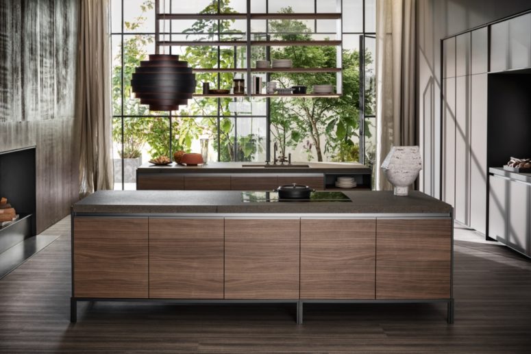The countertops are durable and solid, the wooden cabinets add a necessary play of materials and a chic look