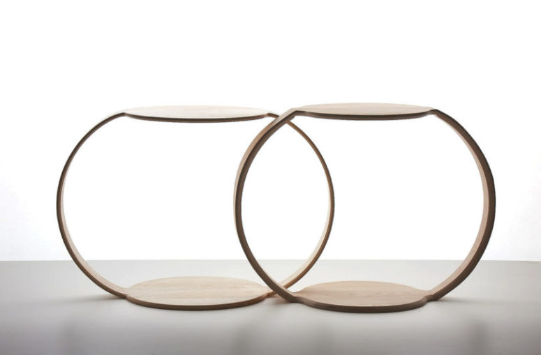 The item is made of molded ash veneers, and the round tabletop matches the opposite, which is the foot of the table