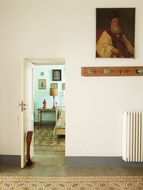 The owners loved the original tile floor, and added quirky touches and funny pieces