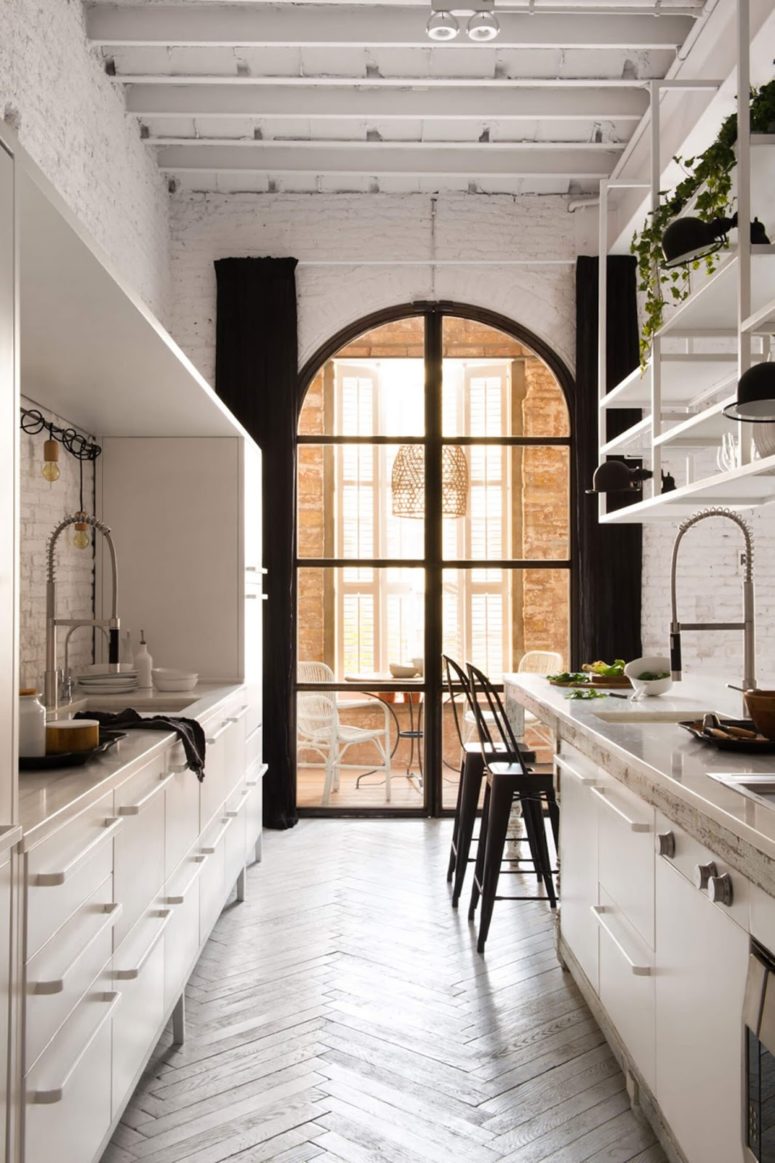 There are big arched windows everywhere that fill the home with light, and curtains keep the privacy when necessary