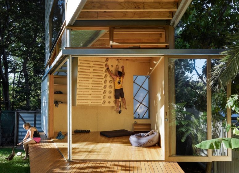 The first space is like a home gym, with various sport stuff and a climbing wall