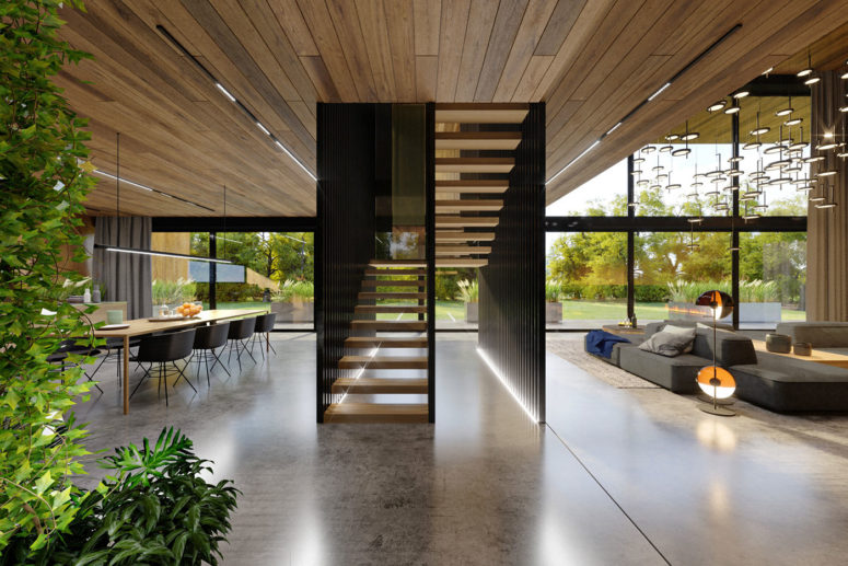 The staircase was used to slightly separate the living room from the kitchen and dining zone
