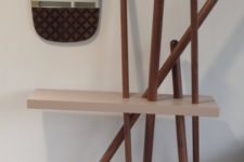 03 This is a coat hanger and a console and can be used throughout home for the same purposes, not only in entryways