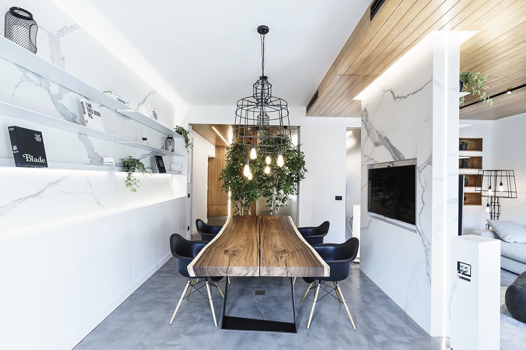 This space is used as a dining room and a conference space and is versatile enough for both