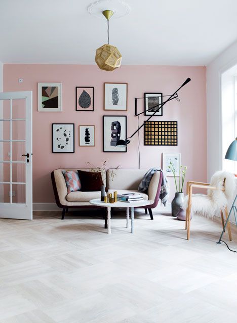 a chic living room with a Scandinavian feel looks more interesting with a pink accent wall