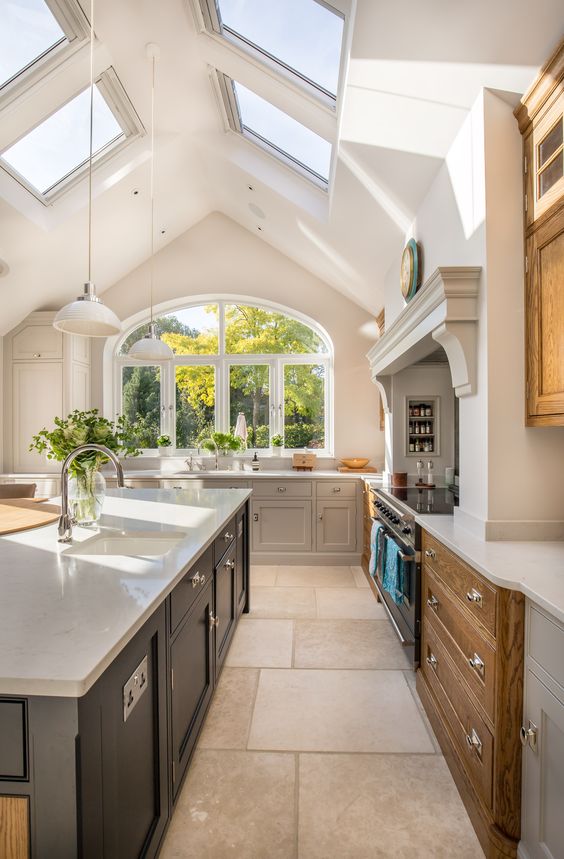 a modern looking vaulted ceiling with skylights that bring much light in