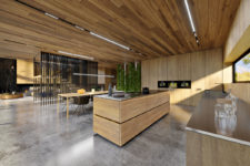 04 The kitchen is fully clad with light-colored oak, the countertops are of stainless steel