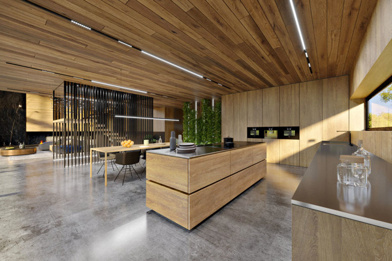 The kitchen is fully clad with light-colored oak, the countertops are of stainless steel