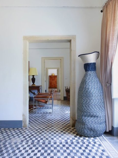 The woven sculpture is by Colantonio; in the living room beyond, a pair of leather Wassily chairs