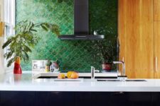 04 a masculine inspired kitchen with forest green fish scale tile and white countertops