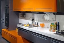04 a minimalist kitchen wit graphite grey and orange cabinets looks contrasting and very bold